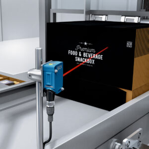 A SICK DT50 distance sensor measures carton fill levels SICK’s Fill Level Monitoring Keeps Packaging Machines Topped Up