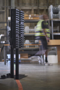 Charging Tower with worker blurred Health and safety experts, Stanley, partner with new AI technology providers to help cut workplace accidents