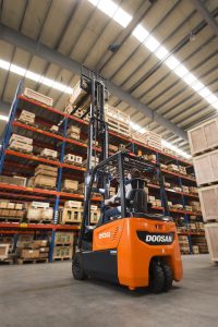 Forklift pic 1 red Doosan Industrial Vehicle transfers parts distribution centre from Belgium to Germany 
